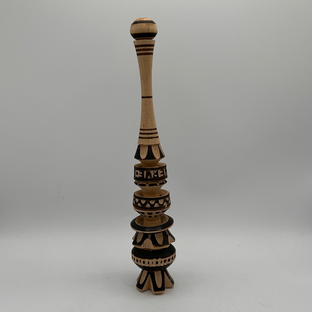 Traditional Mexican wooden whisk (molinillo) for beverages